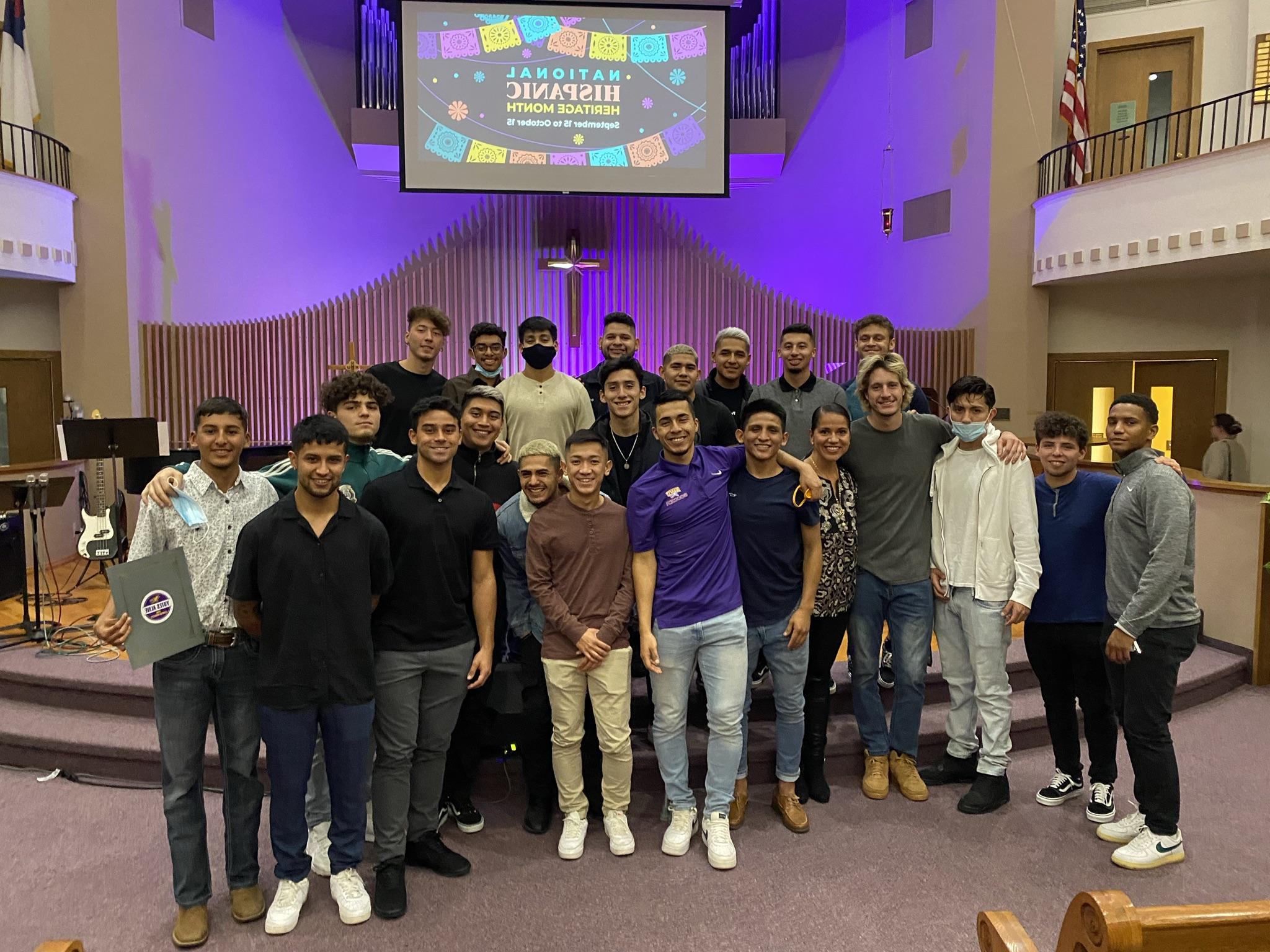 Group of people in front of church pulpit